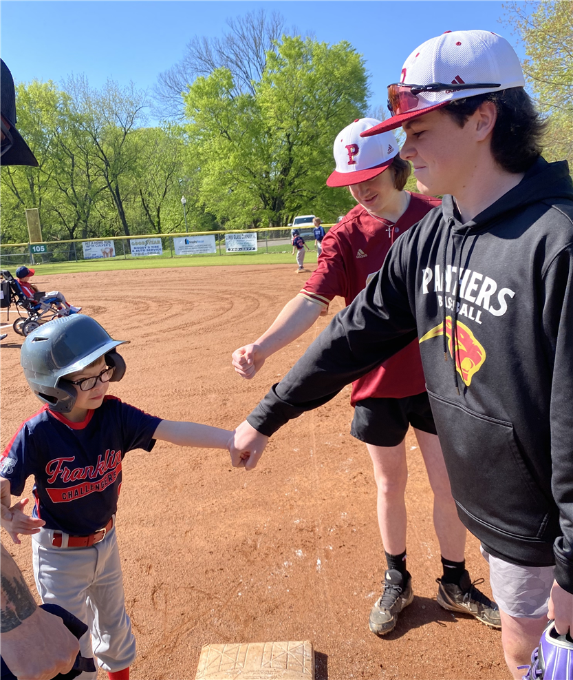 Students playing baseball